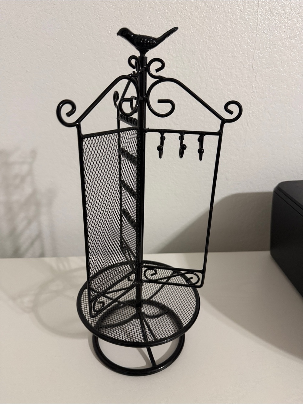 Rotating Black Metal Jewelry Organizer Stand with Bird Accent